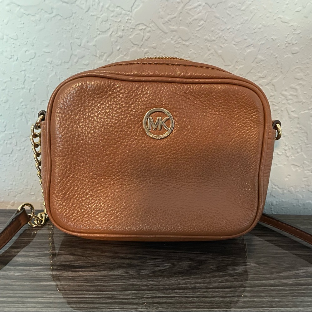 Very used MK crossbody. With a little TLC it can be brand new.